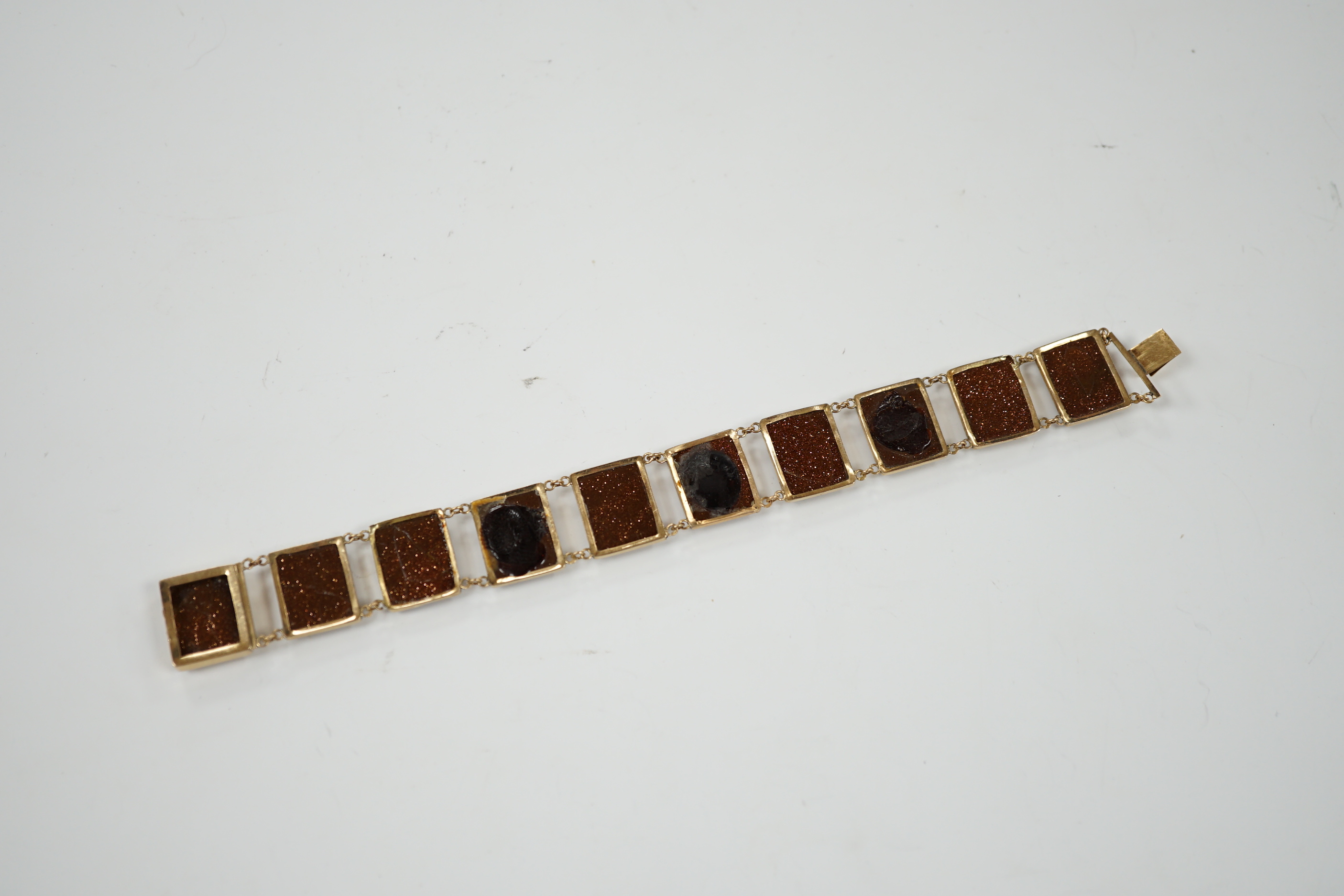 An Italian yellow metal, micro mosaic and goldstone set bracelet, with panels of Italian figures and insects, 17.3cm, gross weight 15.6 grams